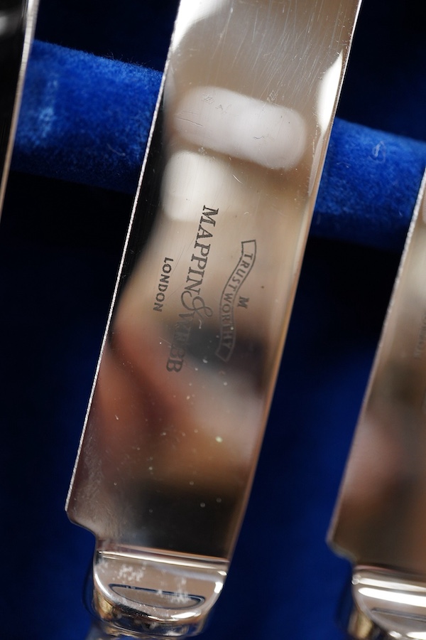 An Elizabeth II canteen of silver cutlery for eight, by Mappin & Webb, comprising table and dessert forks, dessert, soup and teaspoons, silver handled steel table and dessert knives two table or serving spoons and a pair